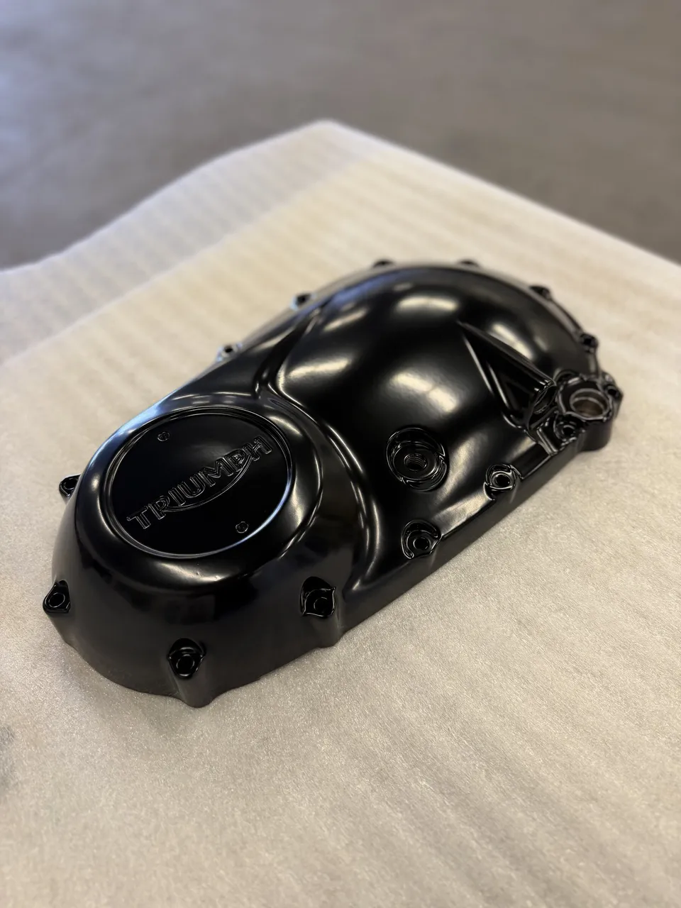 Gloss black powder-coated motorcycle engine cover